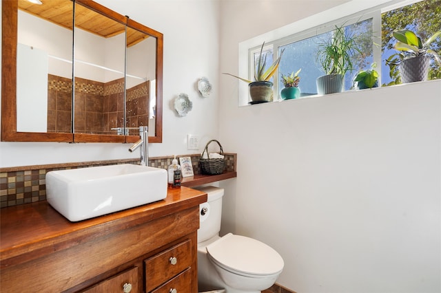 bathroom with vanity, a shower, toilet, and wooden ceiling