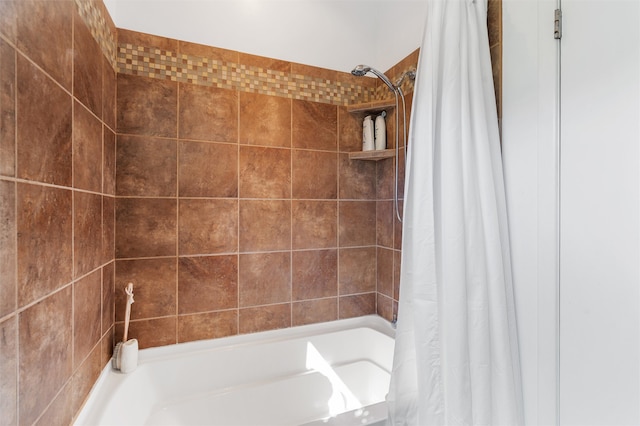 bathroom with shower / bathtub combination with curtain