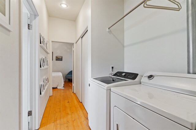 washroom featuring light hardwood / wood-style floors and independent washer and dryer