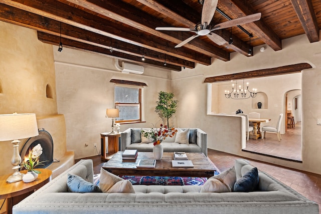 living room featuring beam ceiling, a wall mounted air conditioner, ceiling fan with notable chandelier, and wooden ceiling