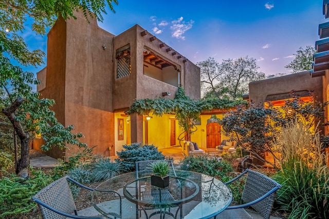 view of patio terrace at dusk