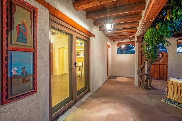 corridor featuring beamed ceiling