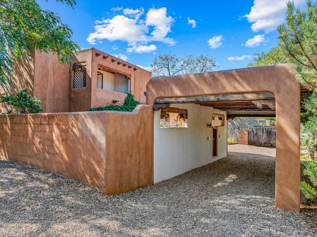 exterior space with a carport