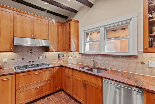 kitchen with sink, backsplash, stone countertops, stainless steel appliances, and beamed ceiling