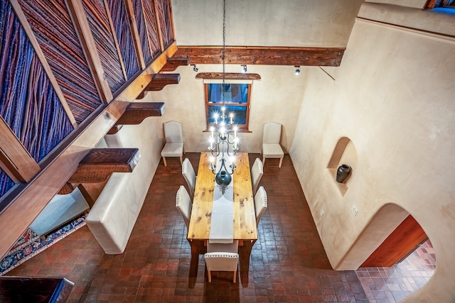 dining area featuring beamed ceiling