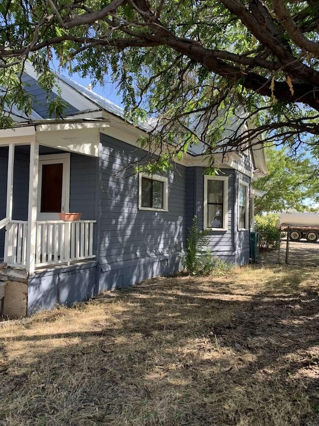 view of property exterior featuring a porch