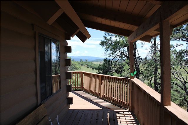 wooden terrace featuring a mountain view