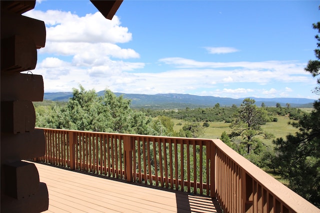 wooden deck featuring a mountain view