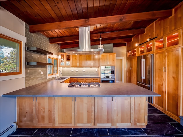 kitchen with island range hood, a baseboard heating unit, sink, decorative light fixtures, and appliances with stainless steel finishes