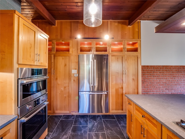 kitchen featuring stainless steel appliances, wooden ceiling, and wood walls