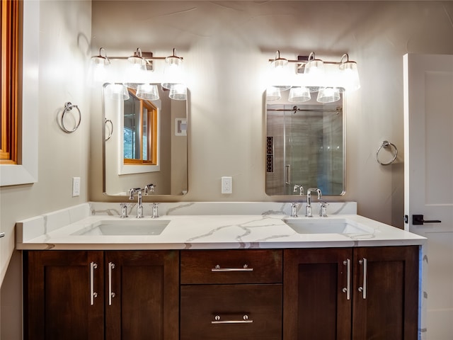 bathroom featuring vanity and an enclosed shower