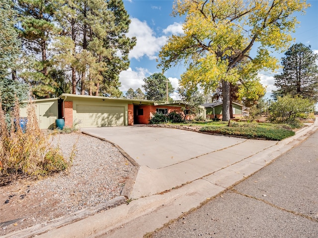 ranch-style house featuring a garage