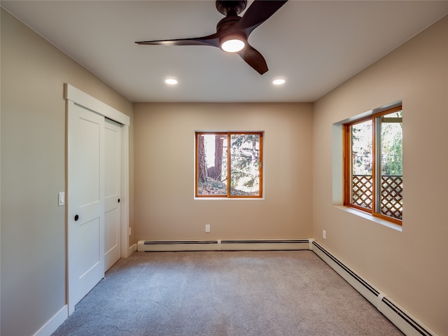 unfurnished bedroom with light carpet, multiple windows, a closet, and ceiling fan