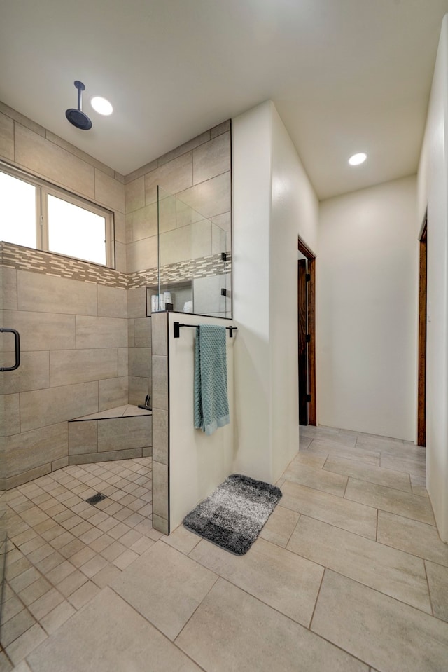 bathroom with a shower with shower door