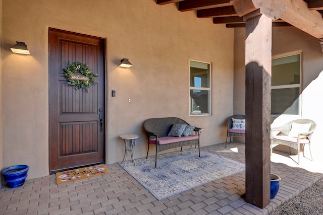 property entrance with a patio