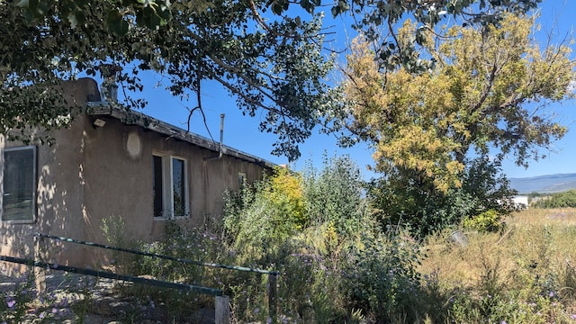 view of home's exterior with a mountain view