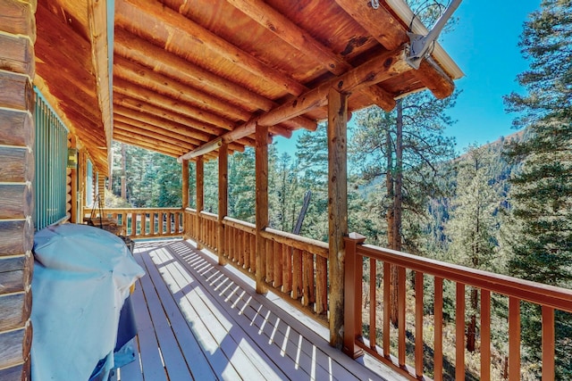 wooden deck featuring grilling area