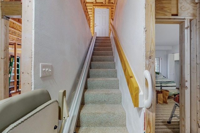 staircase with carpet floors