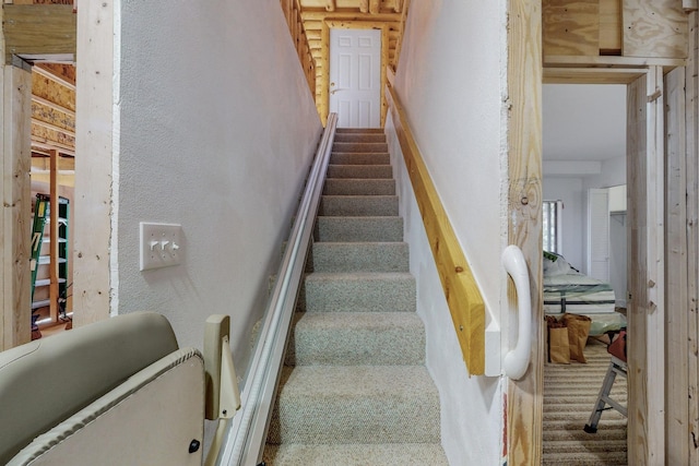 12 Pine Ln, Terrero, NM 87573 - staircase featuring carpet flooring and a textured wall