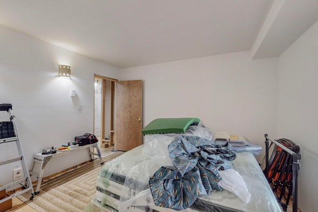 bedroom with hardwood / wood-style floors