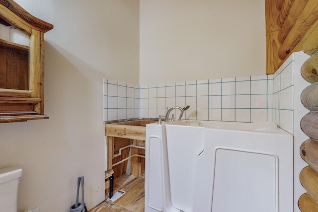 12 Pine Ln, Terrero, NM 87573 - bathroom with a tub to relax in, wood finished floors, and toilet