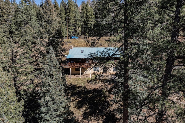 12 Pine Ln, Terrero, NM 87573 - aerial view of property and surrounding area featuring a heavily wooded area