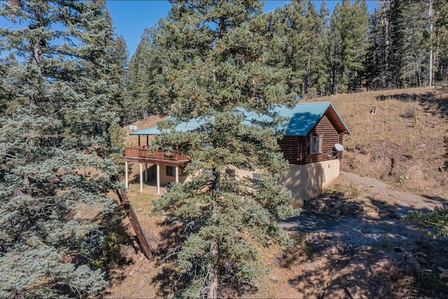 12 Pine Ln, Terrero, NM 87573 - view of side of property featuring log siding and a wooden deck