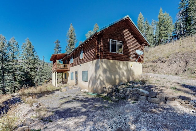 12 Pine Ln, Terrero, NM 87573 - view of side of property featuring log siding and stucco siding