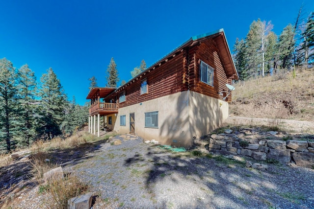 view of property exterior featuring a balcony