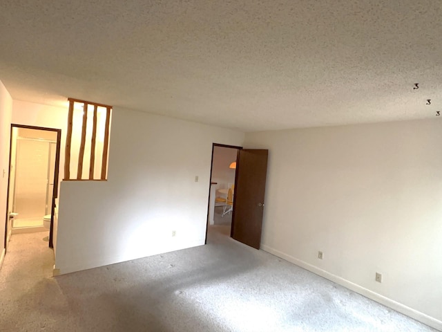 spare room with a textured ceiling