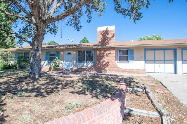 ranch-style home featuring a garage