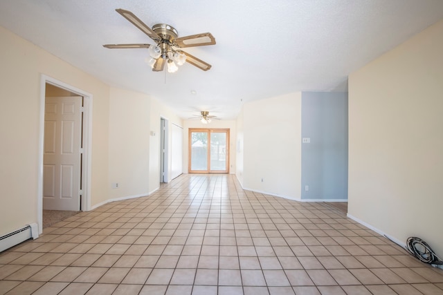 empty room featuring a baseboard heating unit, light tile patterned floors, and ceiling fan