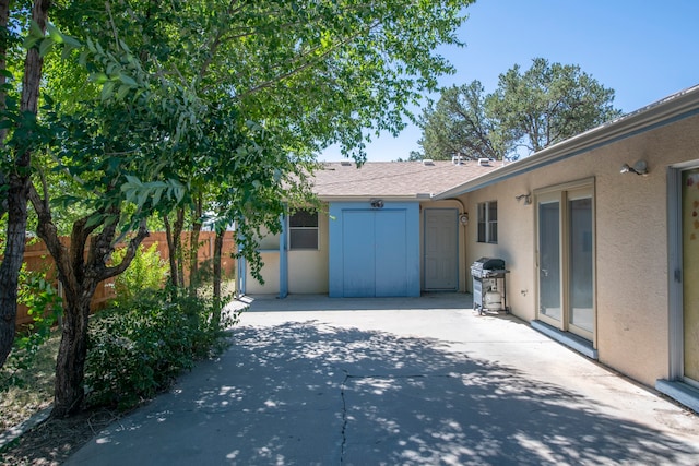 view of side of home with a patio area