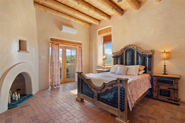 bedroom featuring a high ceiling, beam ceiling, wood ceiling, a wall unit AC, and french doors