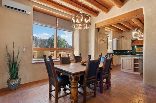 dining area featuring sink, wood ceiling, a chandelier, an AC wall unit, and beamed ceiling