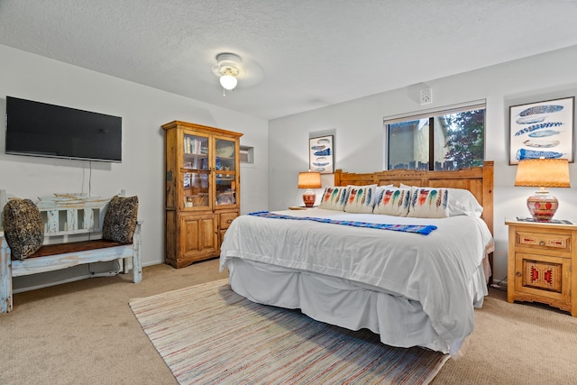 carpeted bedroom with a textured ceiling