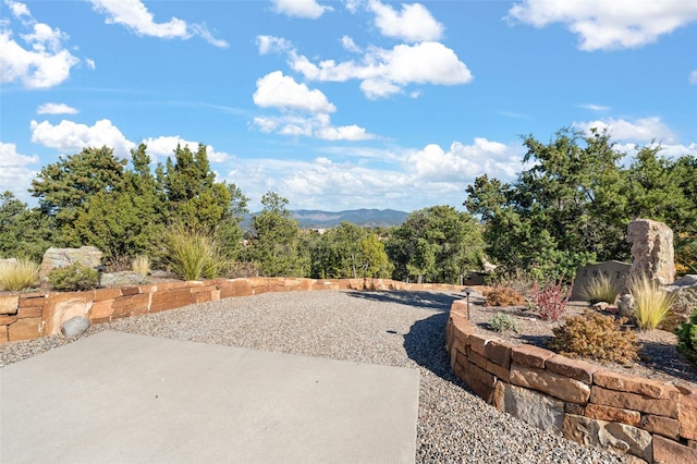 view of patio / terrace featuring a mountain view