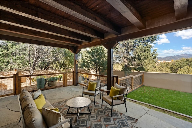 view of patio with outdoor lounge area and a mountain view