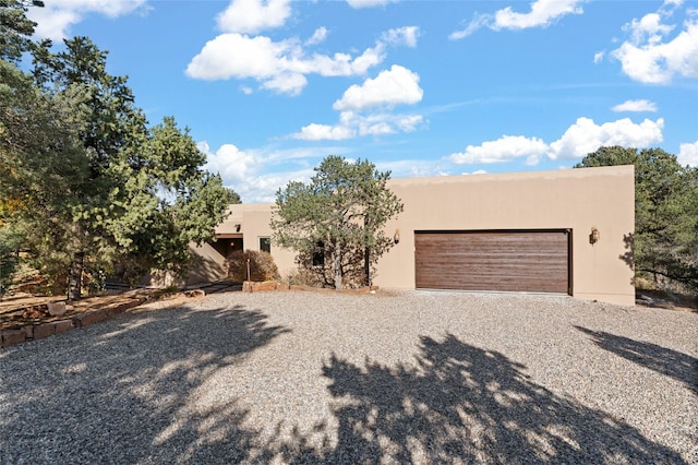 southwest-style home featuring a garage