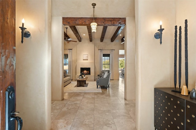 hallway with beam ceiling and light tile patterned flooring