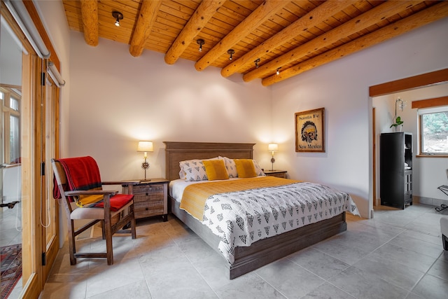 tiled bedroom with wood ceiling and beam ceiling