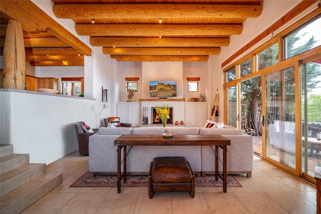 living room with wood ceiling, beam ceiling, and light tile patterned floors