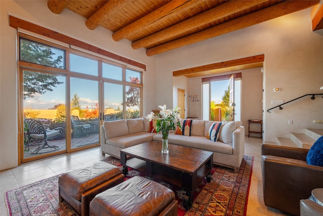 living room with wood ceiling, beam ceiling, and light tile patterned flooring