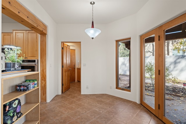 doorway to outside featuring light tile patterned floors