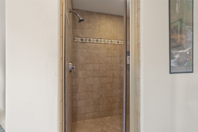 bathroom with tiled shower