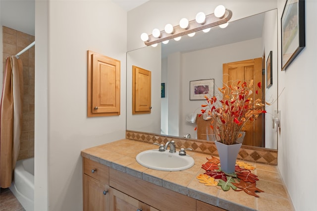 bathroom featuring vanity and shower / bath combination with curtain