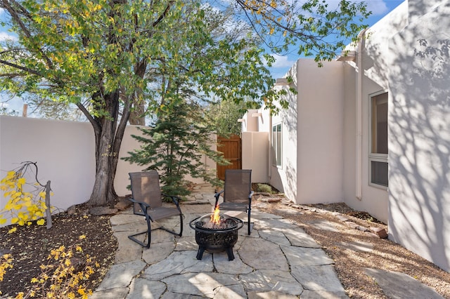 view of patio / terrace with an outdoor fire pit