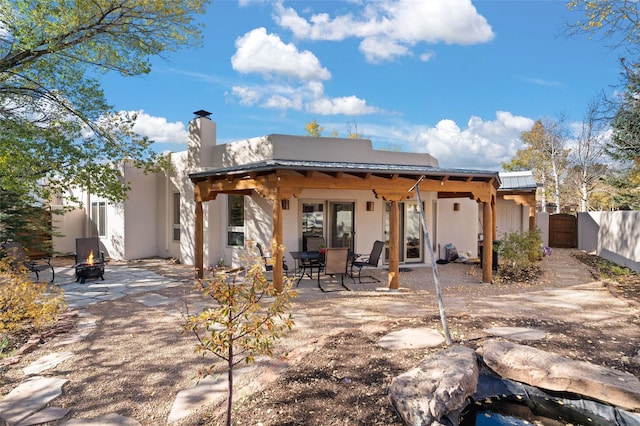 back of house with a patio