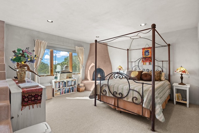 carpeted bedroom featuring recessed lighting