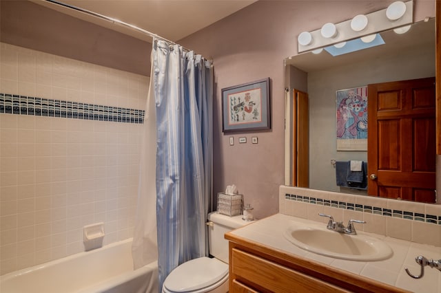 full bathroom featuring vanity, toilet, and shower / bathtub combination with curtain